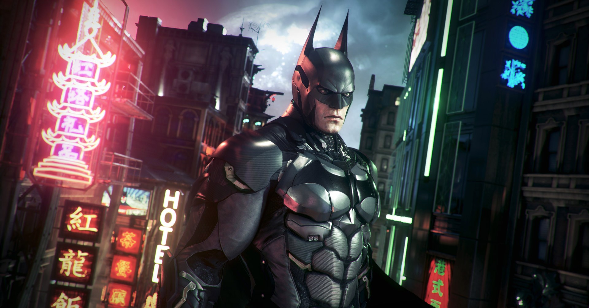 Uma captura de tela de Batman Arkham Knight com Batman parecendo mal -humorado na frente de uma paisagem urbana moderna que se parece com Tóquio, Japão
