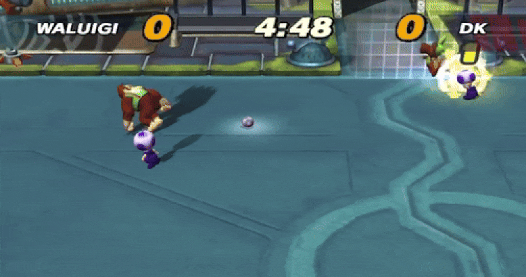 Toad Rams Donkey Kong em um campo eletrificado em Super Mario Strikers