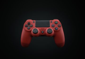 Vibrant red DualShock PS4 controller displayed on a dark background, highlighting modern gaming design.