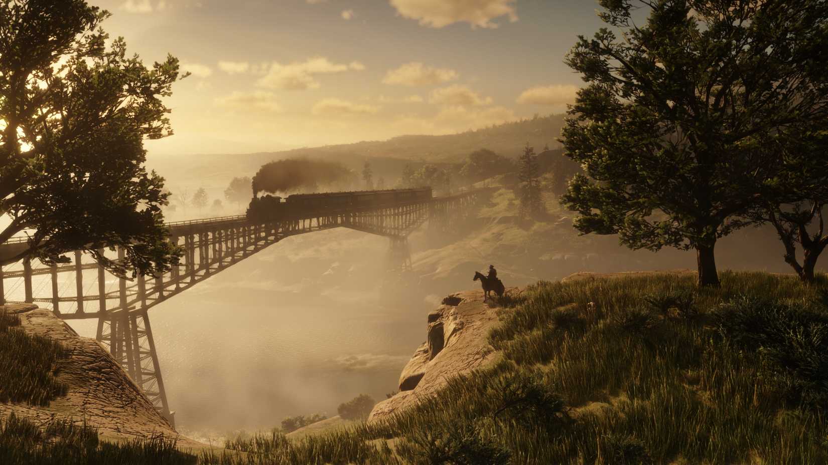 Um trem a vapor atravessa uma ponte sobre um rio na hora dourada em Red Dead Redemption 2