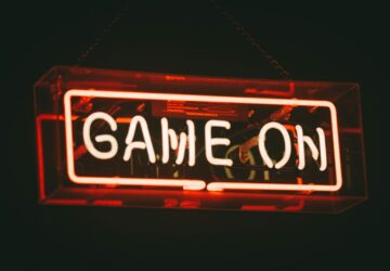 red and white Game On LED signage