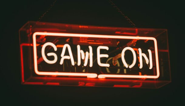 red and white Game On LED signage