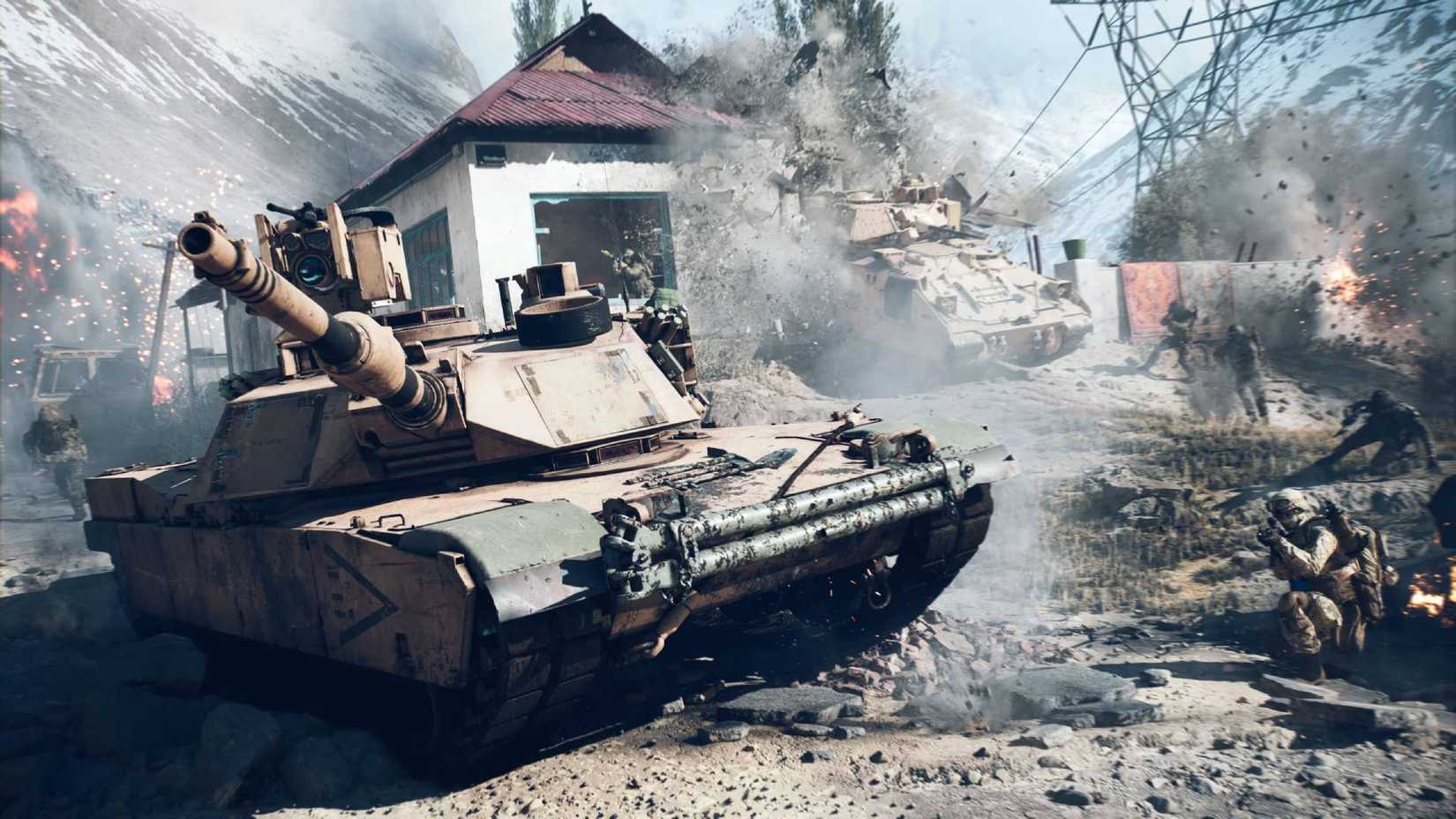 Um tanque em Battlefield 6 com soldados agachados perto dele na estrada, enquanto outro tanque bate em um prédio ao fundo.