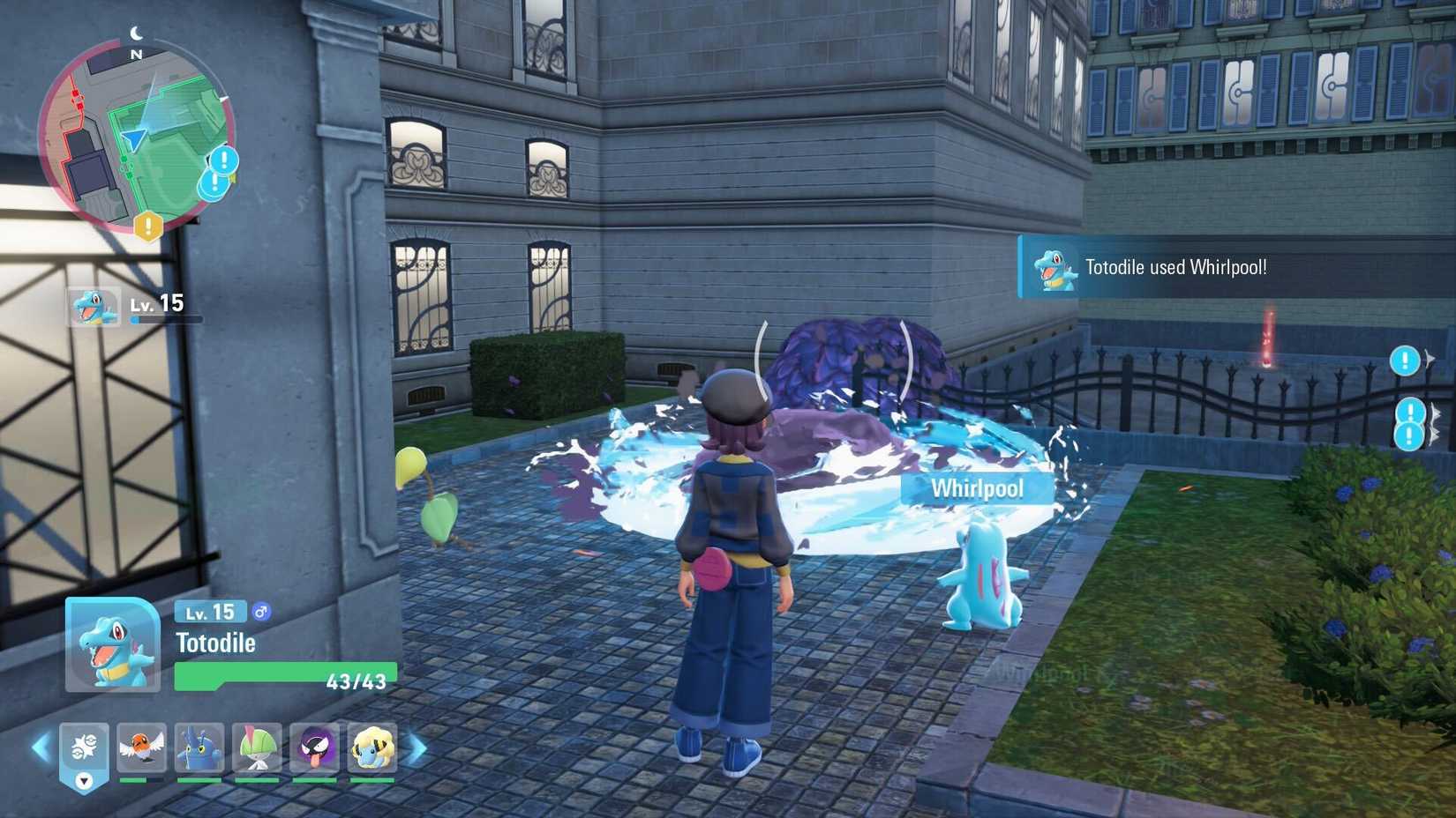 Um Totodile limpa uma pilha de lama roxa em Pokémon Legends: ZA.
