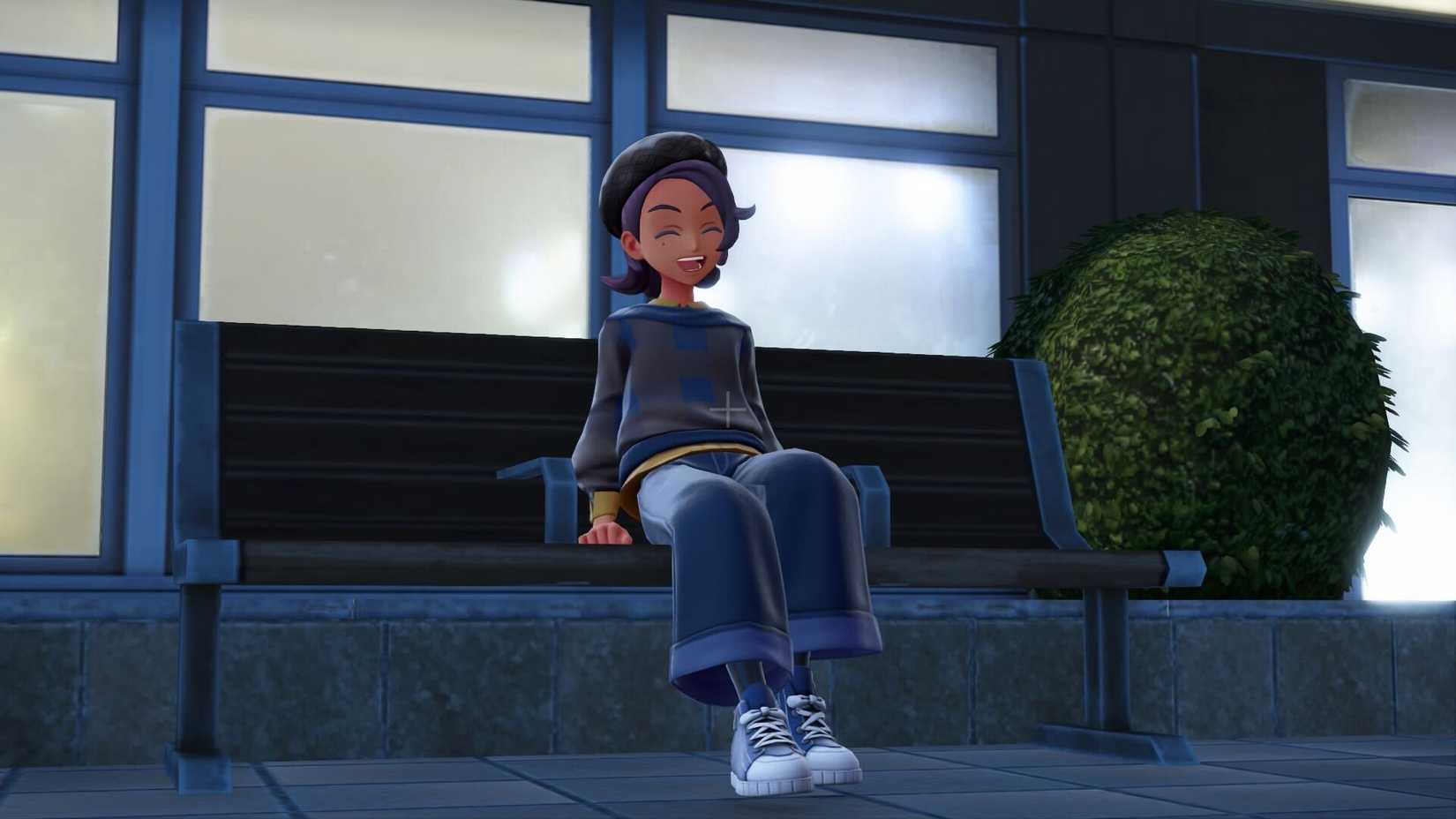 Um personagem Pokémon senta-se feliz em um banco em Pokémon Legends: ZA.