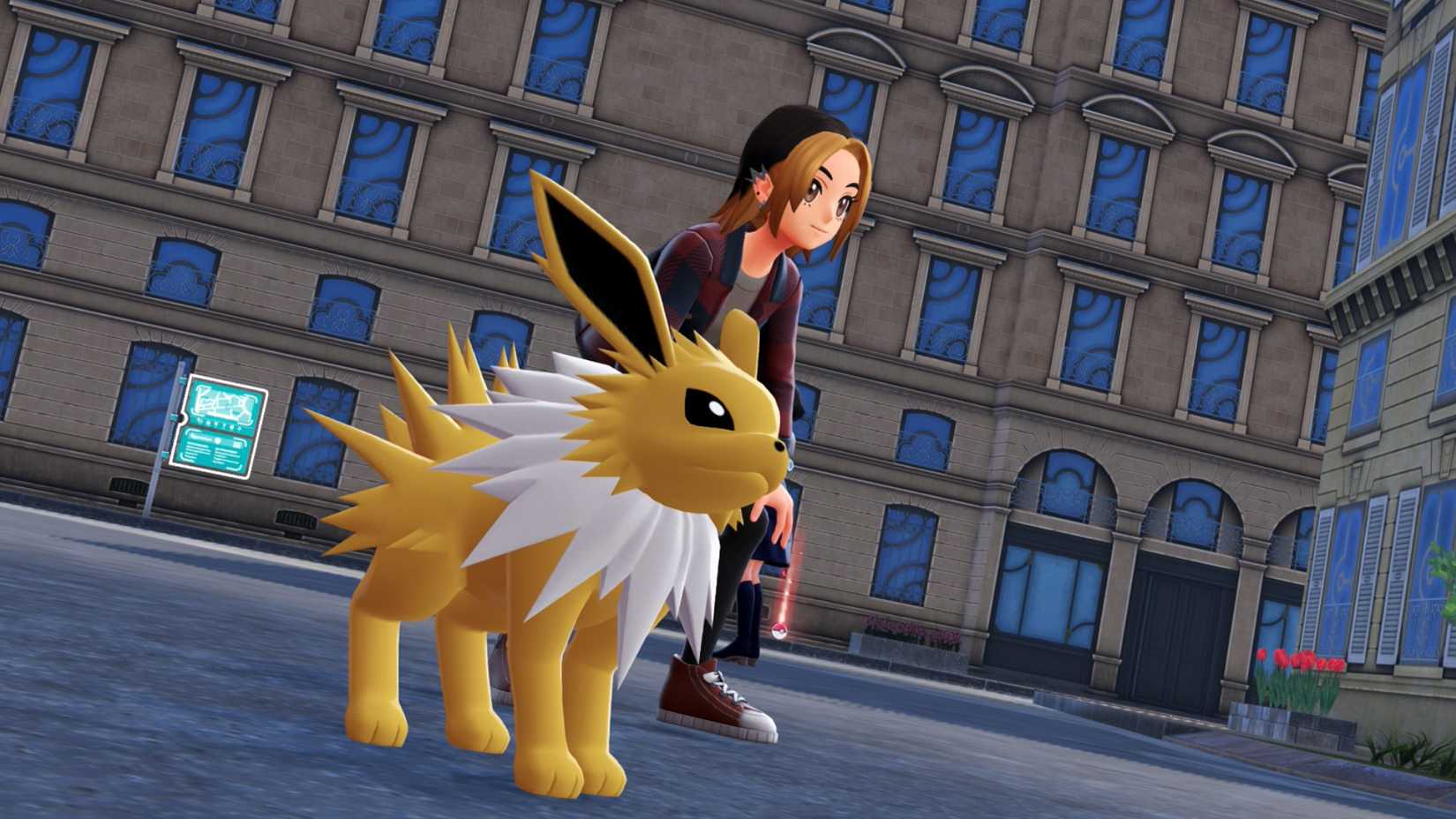 Um treinador se abaixa para posar com seu Jolteon em Pokémon Legends: ZA.