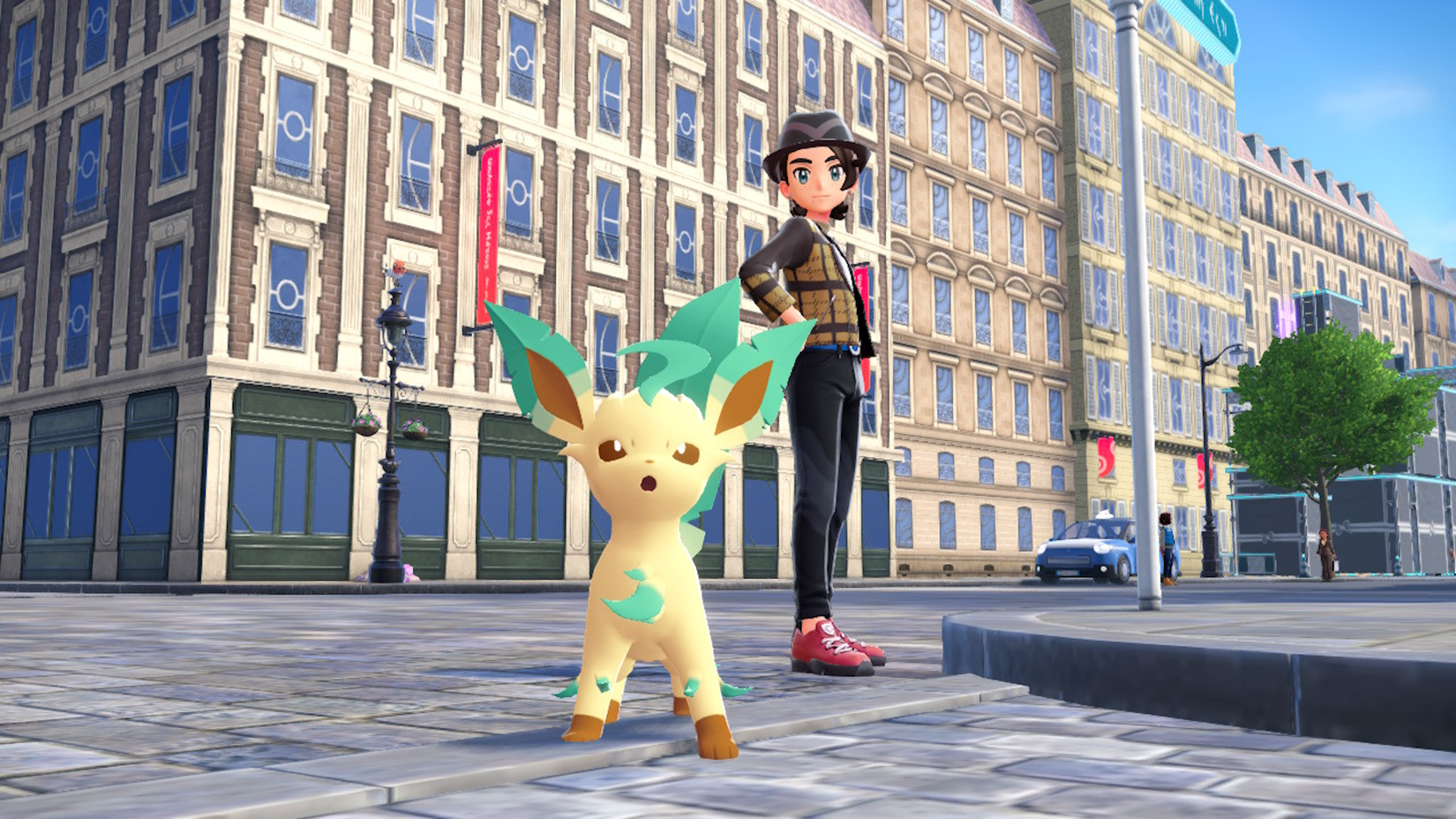 Um treinador Pokémon posa com Leafeon em Pokémon Legends ZA.