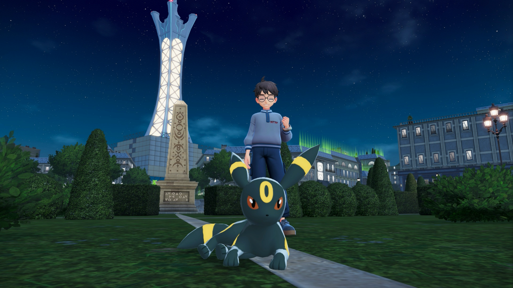 Um treinador Pokémon posa atrás de um Umbreon em Pokémon Legends: ZA.