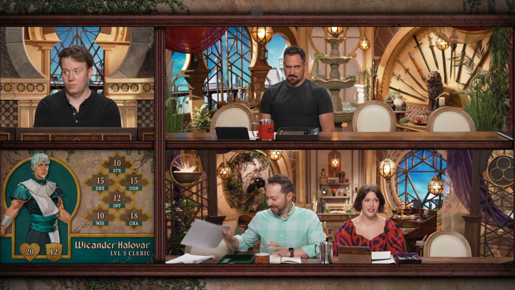 Uma captura de tela com o elenco da Critical Role Campaign 4. Há Whitney Moore, Sam Riegel, Brennan Lee Mulligan e Travis Willingham, todos sentados em uma mesa com objetos de fantasia ao fundo.
