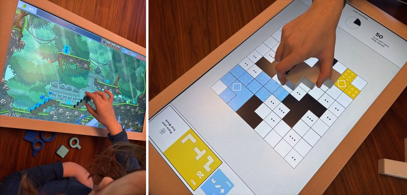 Bloogs (esquerda) e Strata (direita) sendo jogados no tabuleiro