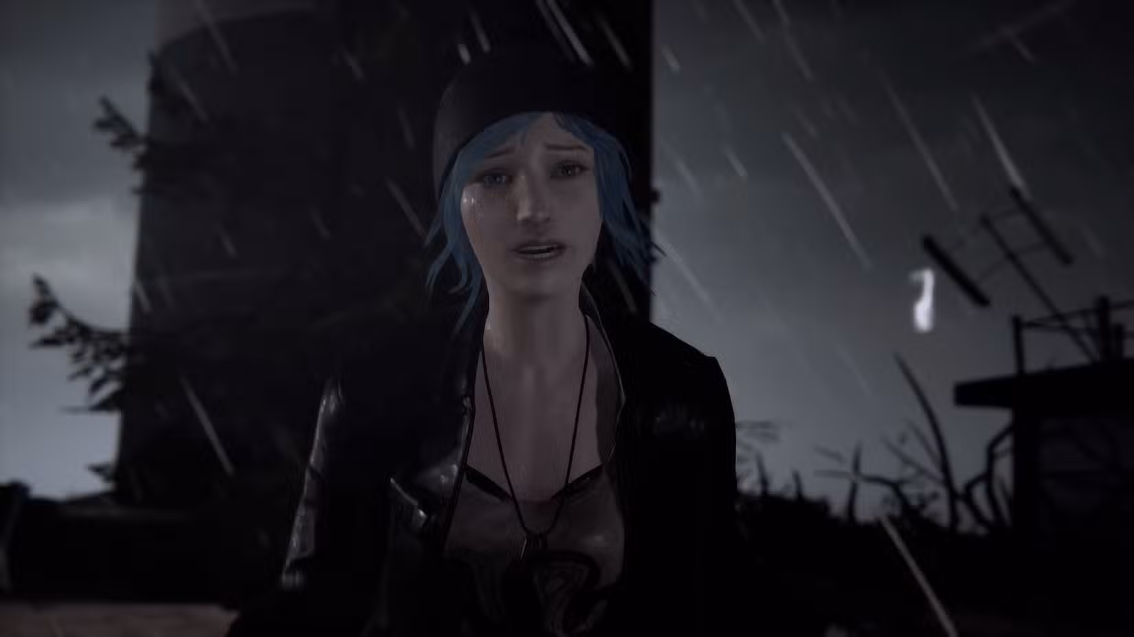 Uma captura de tela de Life is Strange Remastered. Mostra Chloe Price, encharcada até os ossos, com chuva e um fundo escuro atrás dela.