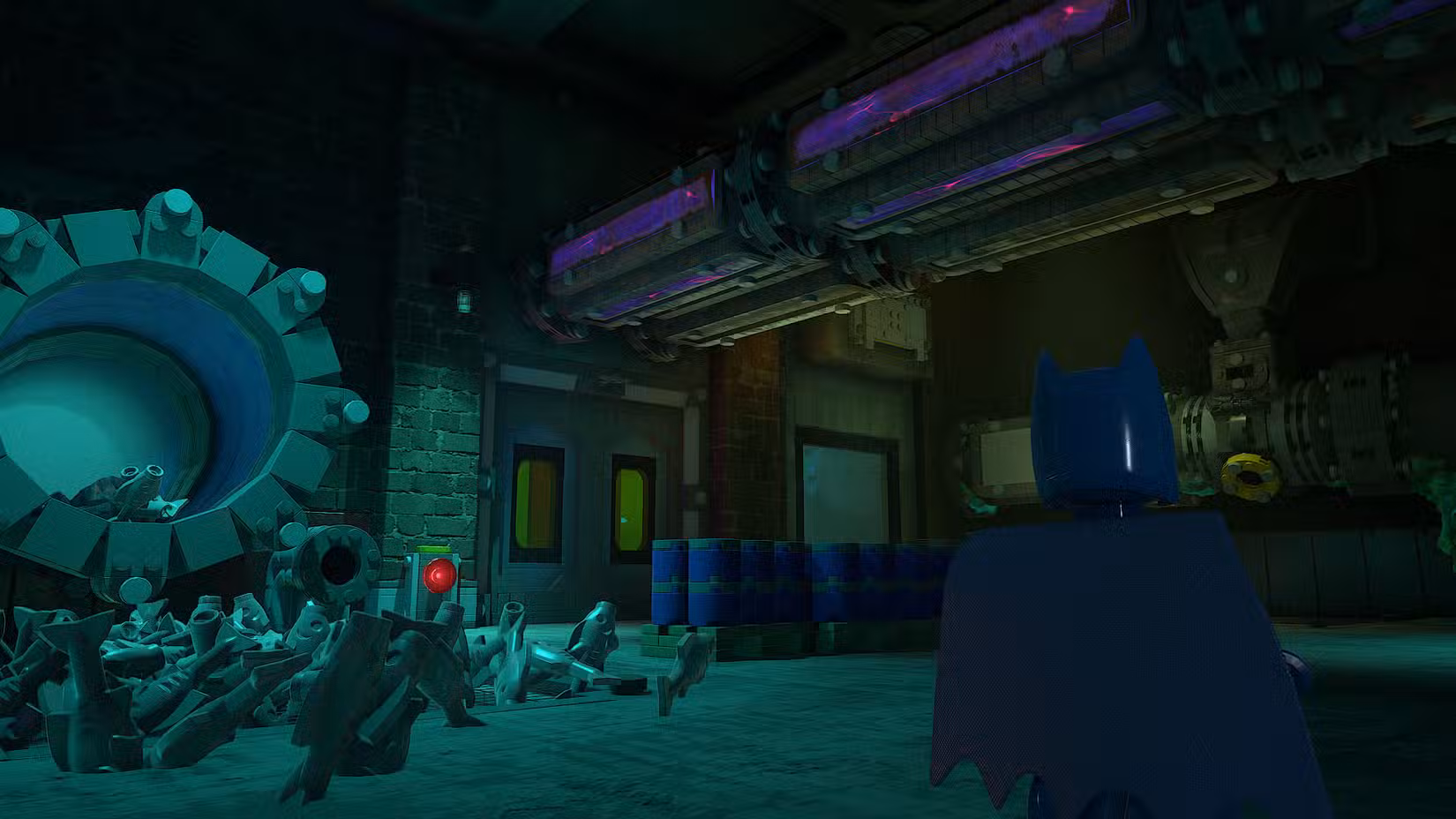 Uma captura de tela de Lego Batman: Legacy of the Dark Knight mostrando Batman parado em frente à porta que leva ao corredor onde você pode encontrar o tijolo vermelho no 