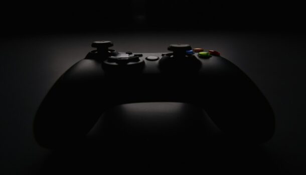 shallow focus photography of black Xbox controller