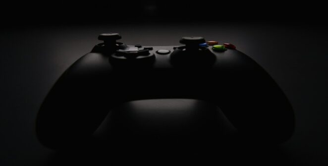 shallow focus photography of black Xbox controller