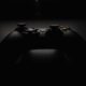 shallow focus photography of black Xbox controller