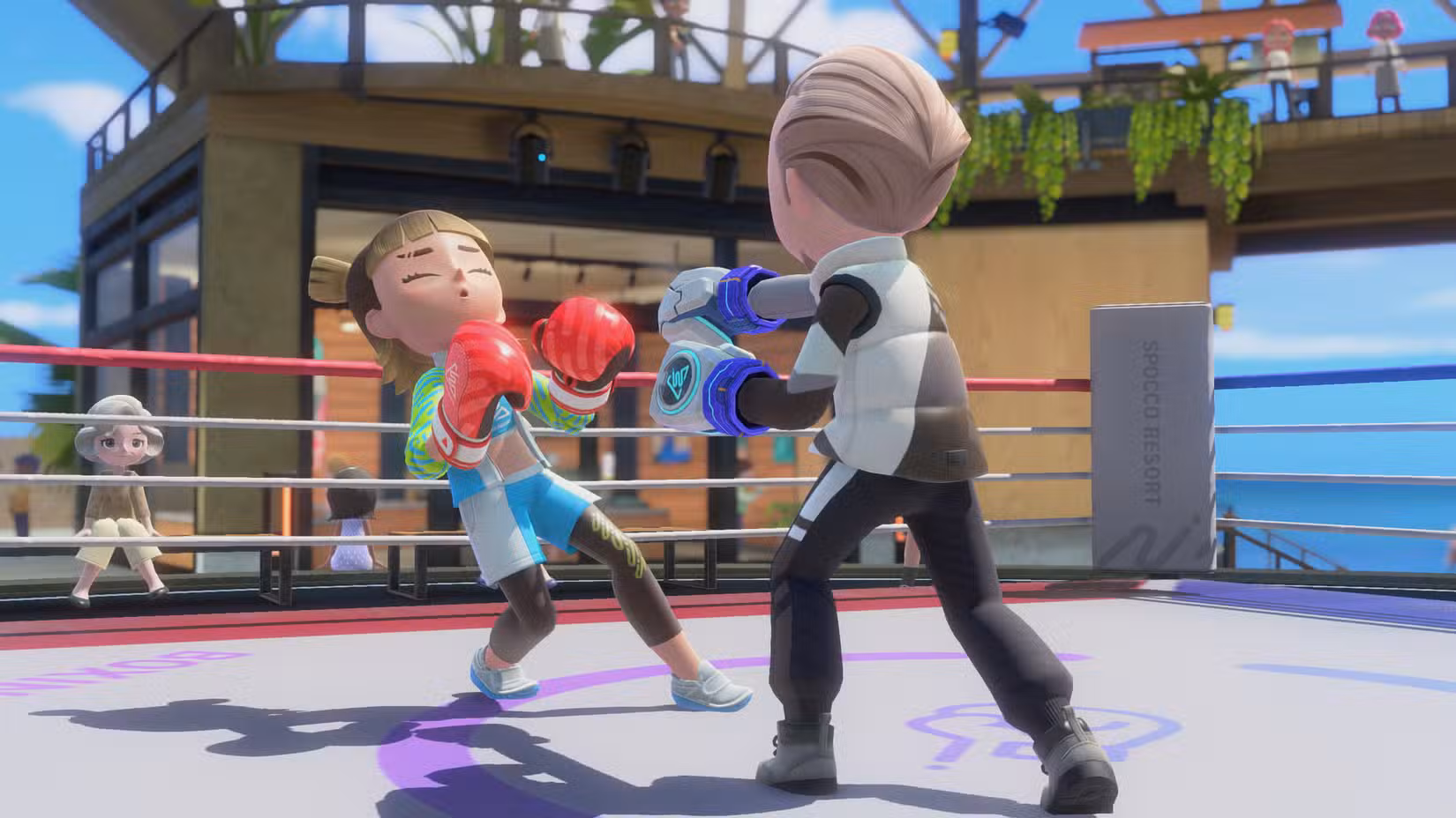 Um Mii dá um soco em outro no boxe Switch Sports