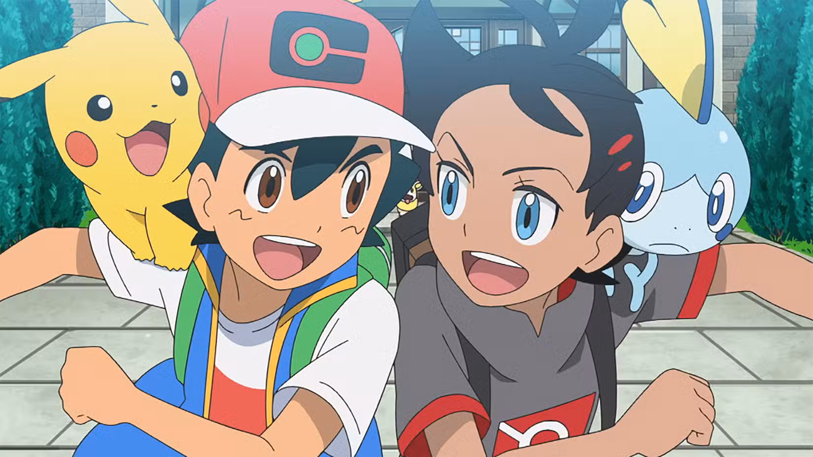 Um garoto de anime sorridente (Ash) com uma criatura de rato amarelo em seu ombro (Pikachu) esbarra em outro garoto de anime sorridente com (Goh), que tem uma criatura parecida com um peixe de aparência apreensiva em seu ombro. (Sobre).