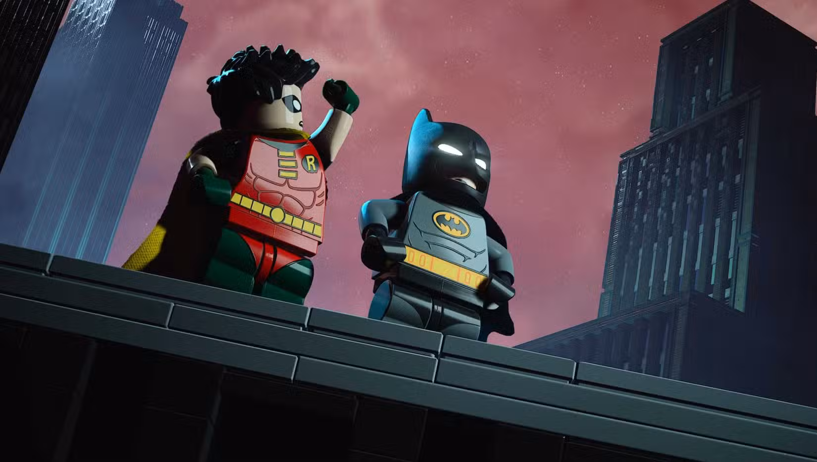 Lego Batman Legado do Cavaleiro das Trevas Batman e Robin parados em um telhado em uma paródia da abertura do BTAS
