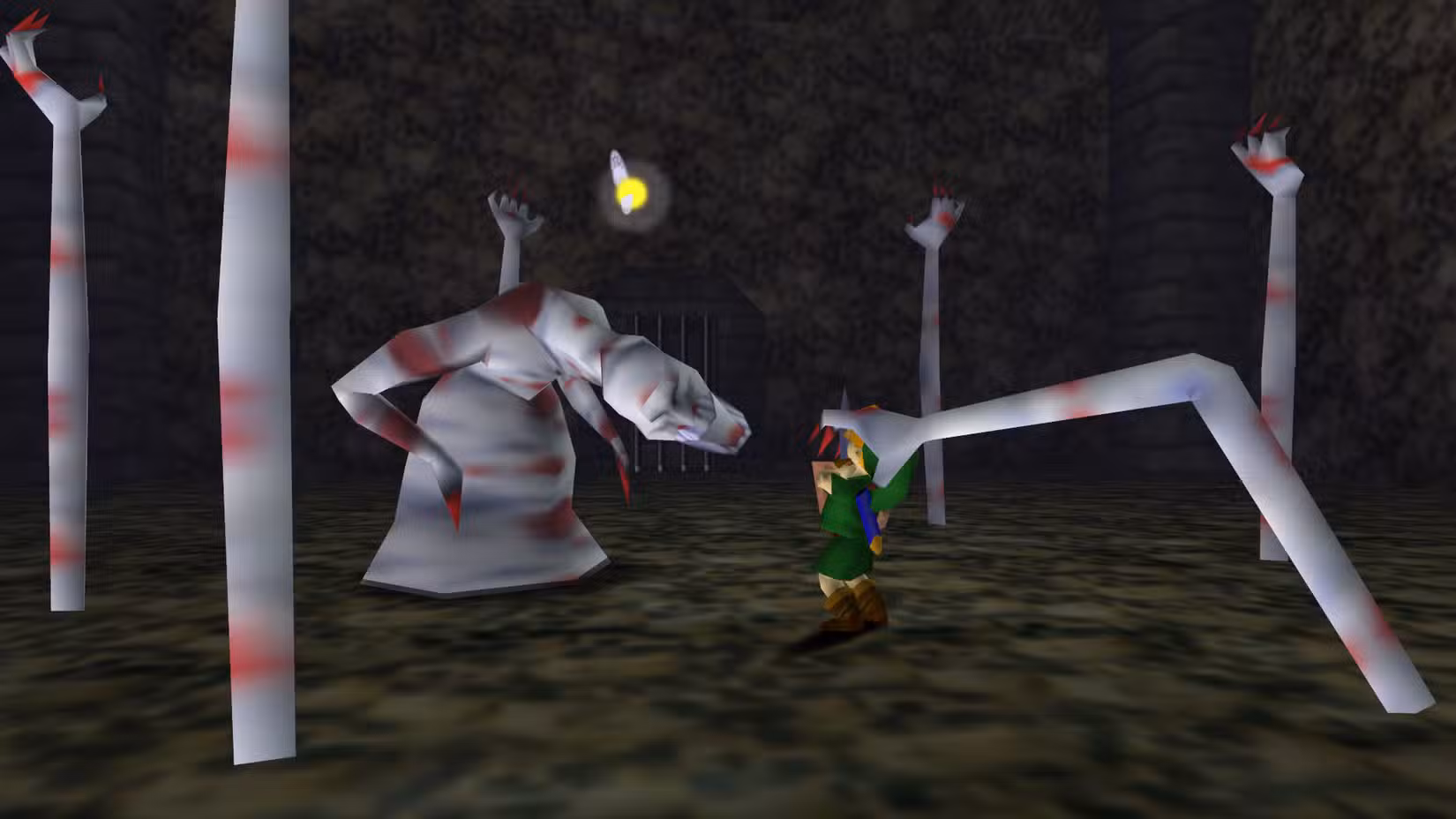 Dead Hand agarra o jovem Link na masmorra Bottom of the Well em Ocarina of Time