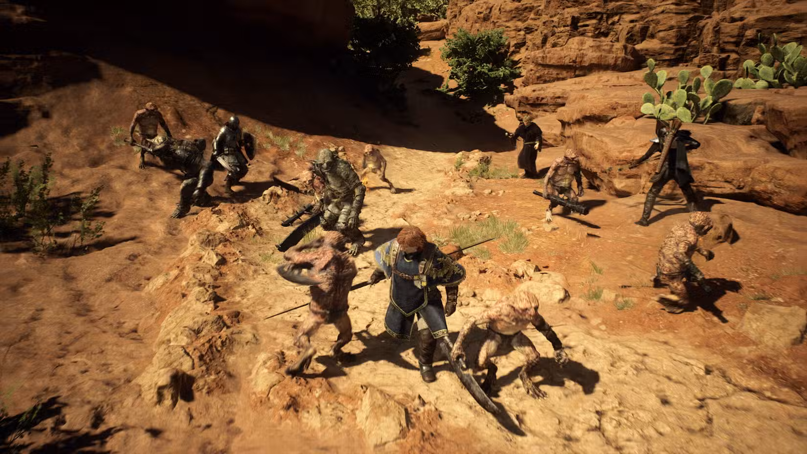 Aventureiros são atacados por uma multidão confusa de goblins em uma área arenosa em Dragon's Dogma 2