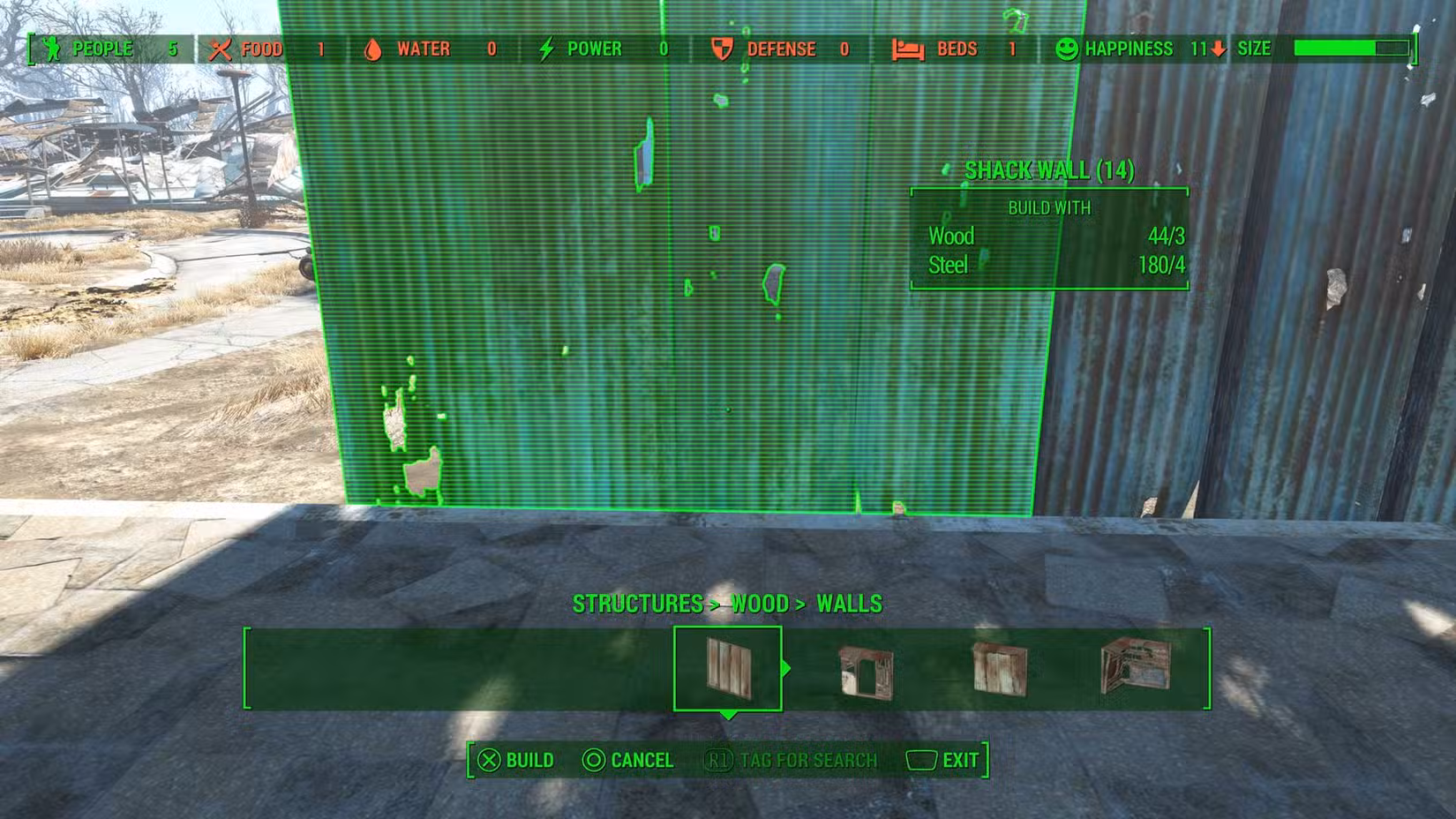 Um close do processo de construção da base no Fallout 4, com uma parede prestes a ser colocada contra uma fundação