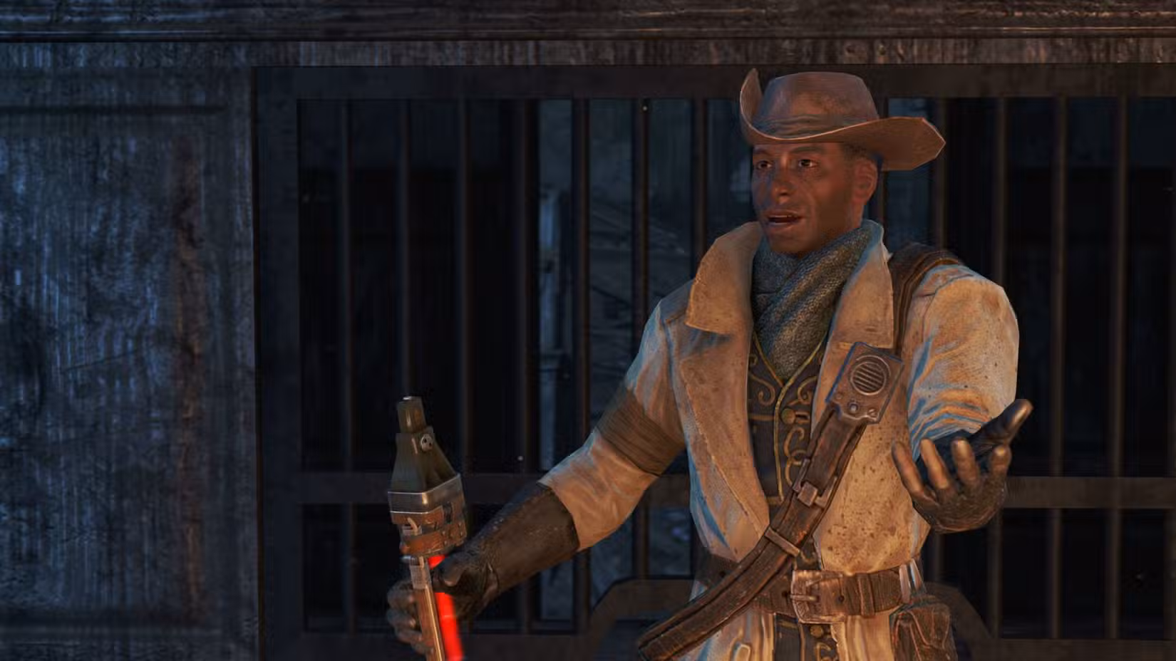 Preston Garvey, líder da facção Minutemen, gesticula enquanto segura seu rifle