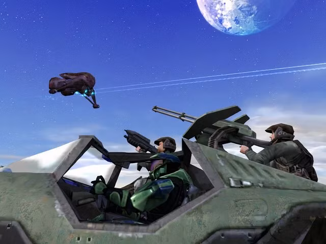 Master Chief dirige um Warthog acompanhado por fuzileiros navais enquanto um Banshee sobrevoa