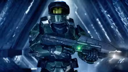 Master Chief em Halo: Campaign Evolved segurando um rifle de assalto.