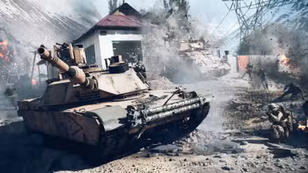Um tanque no Battlefield 6 com soldados agachados perto dele na estrada enquanto outro tanque bate em um prédio ao fundo.
